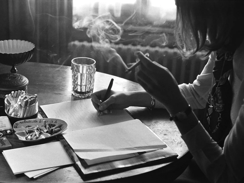 woman smoking and writing